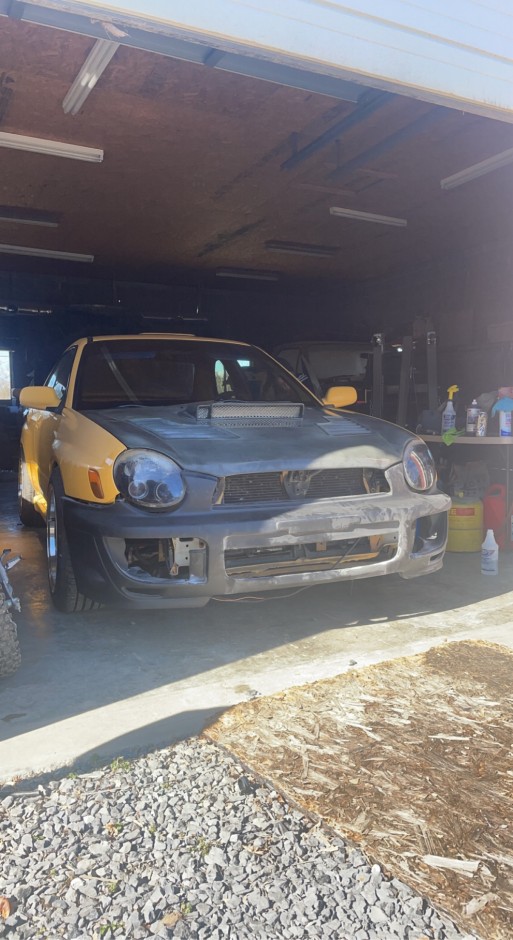 Tyler Surratt's 2003 Impreza WRX Sonic Yellow 2.0 wrx